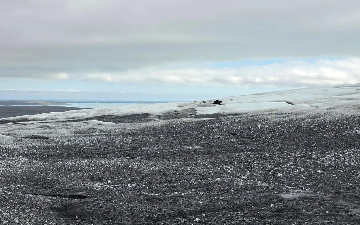 Guided walkers on the ice of Vatnajökull above the icebergs of Jökulsárlón lagoon